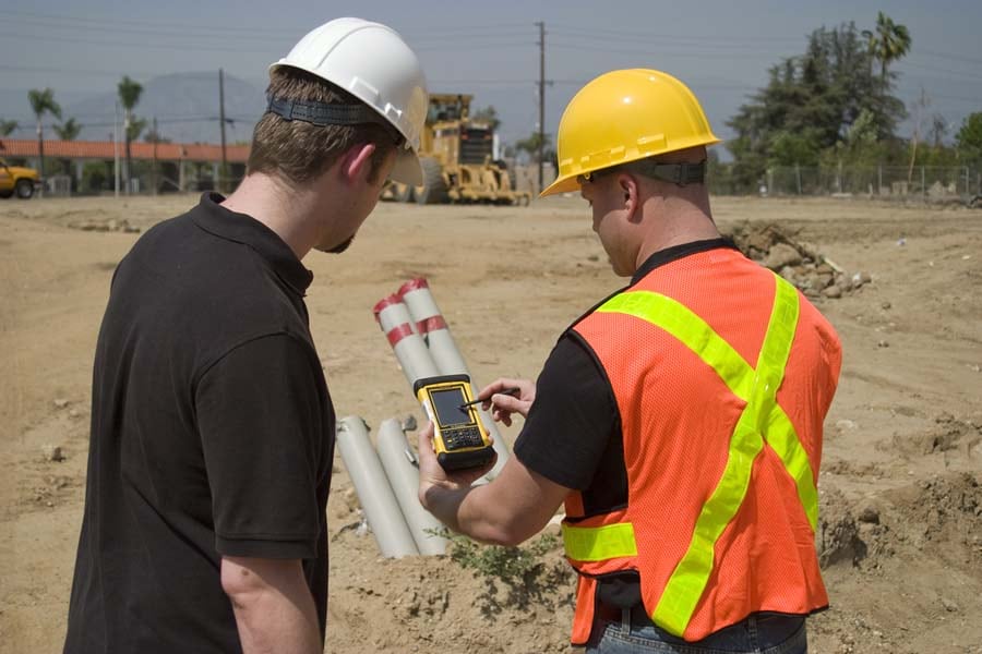 Workers collect data using ArcPad 10.2 on a Trimble Nomad device.